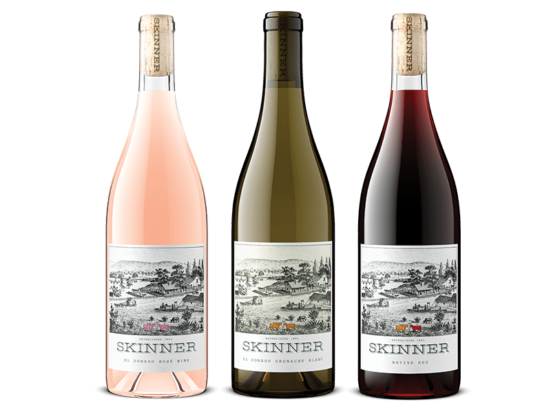 Three bottles of Skinner wine including El Dorado Rose Wine, El Dorado Grenache Blanc, and Native Red