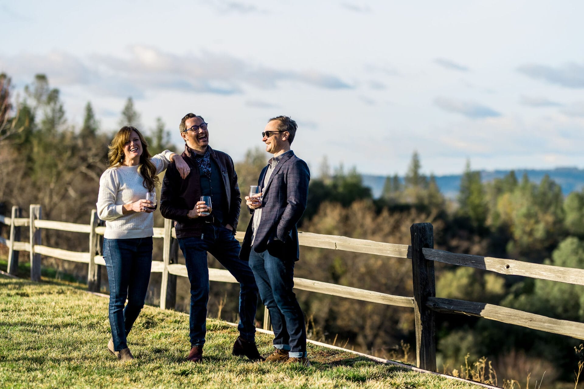 three people attending an event onsite at a winery